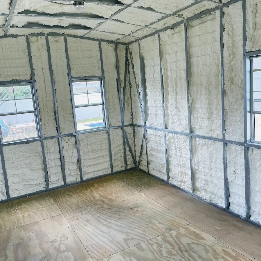 Closed-cell spray foam insulation applied to wall cavities in a residential project in Hampstead